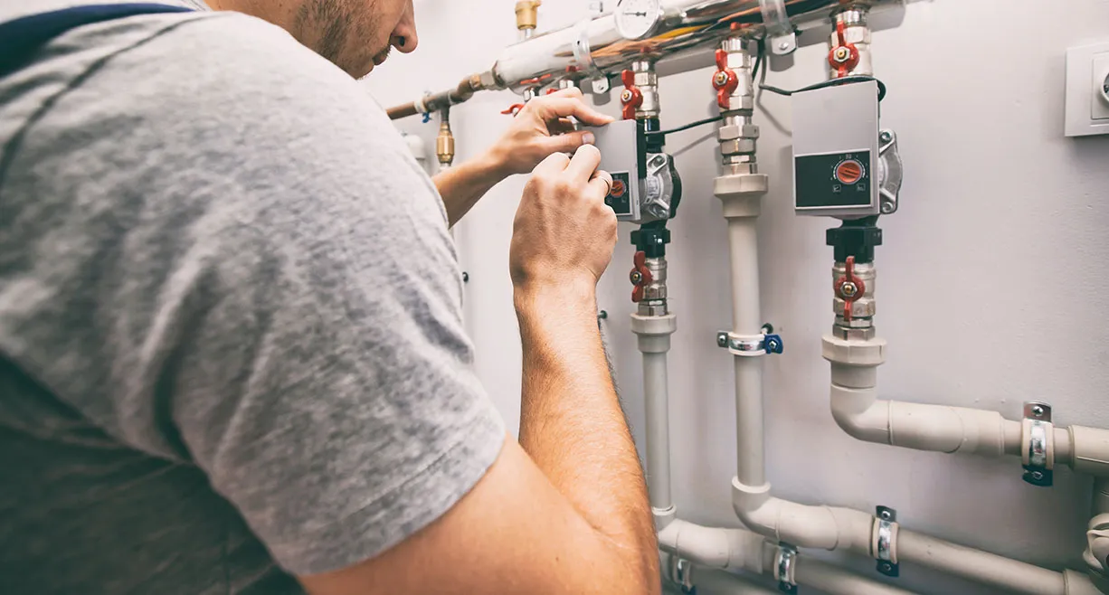 A man working on an electrical panel.